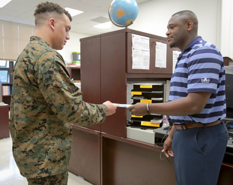 Moving for any reason can be a difficult task. The staff in the Distribution Management Office at Marine Corps Logistics Base Albany helps ease the moving burden for the installation’s personnel. The office is a part of the base’s Logistics Support Division. It is responsible for the operation of official passenger travel arrangements, conducting overseas bookings, group moves and charter transportation to satisfy various Marine Corps schools, exercises and training requirements, as well as individual government travelers and their families. (U.S. Marine Corps photo by Jennifer Parks)