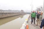 A group of people view the McAlpine Locks