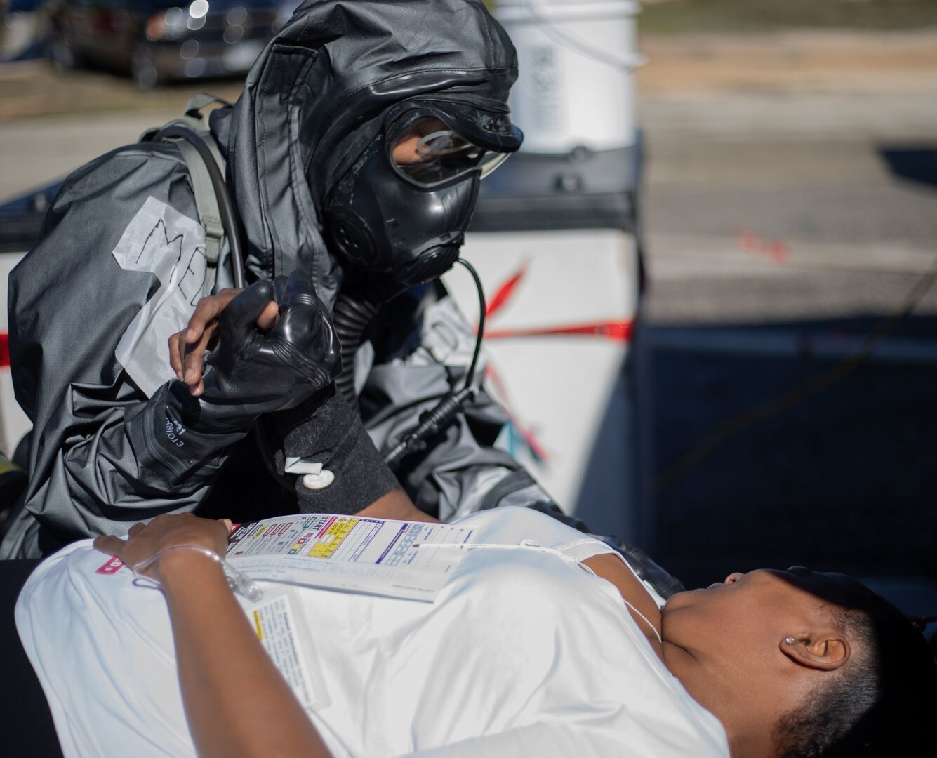 Pfc. Aryanna Tate, assigned to 546th Area Support Medical Company, comforts a role player in a simulated decontamination line Jan. 26 at Travis County Exposition Center in Austin, Texas, as part of Exercise Sudden Response 20.