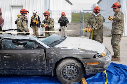 Service members assigned to the 3rd Platoon, 68th Engineer Company urban rescue team conduct a car rescue during a simulated urban search and rescue mission Jan. 25 as part of Exercise Sudden Response 20.
