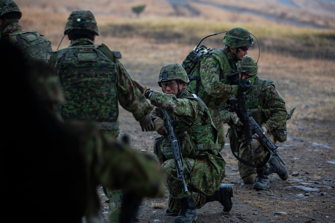 Japan Ground Self-Defense Force Service Members disembark from an MV-22B Osprey with U.S. Marines to conduct On-Off Drills during exercise Forest Light Western Army at Camp Oyanohara, Kyushu, Japan, Jan. 22.