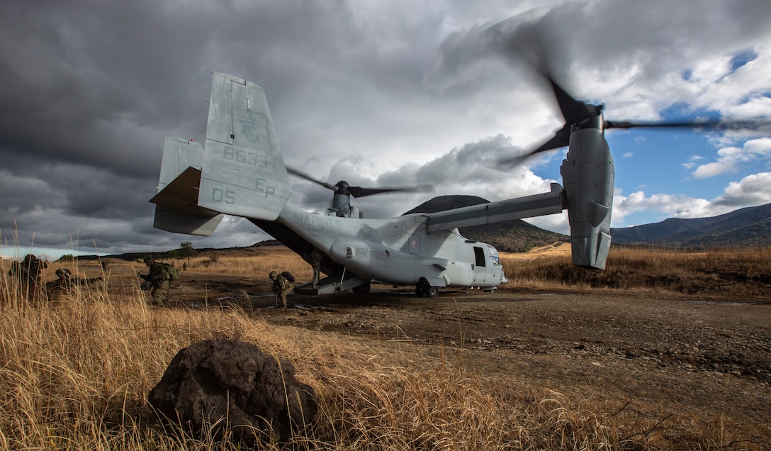 Japan Ground Self-Defense Force Service Members disembark from an MV-22B Osprey with U.S. Marines while conducting Vertical Assault training during exercise Forest Light Western Army at Camp Takayubaru, Kumamoto, Japan, Jan. 28.