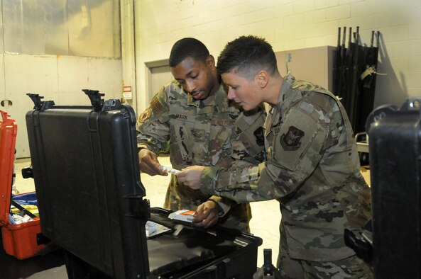 Tech Sgt. Lawrence Mark, 445th Aeromedical Evacuation Squadron aeromedical evacuation technician, works with 2nd Lt. Amanda Hostetter, AES flight nurse, doing inventory at their unit Jan. 5, 2020. The flight nurse and medical technician ensure drug kits have all of the medicine and supplies needed to treat patients during medical evacuation missions. (U.S. Air Force photo/Senior Airman Amelia Burnett)