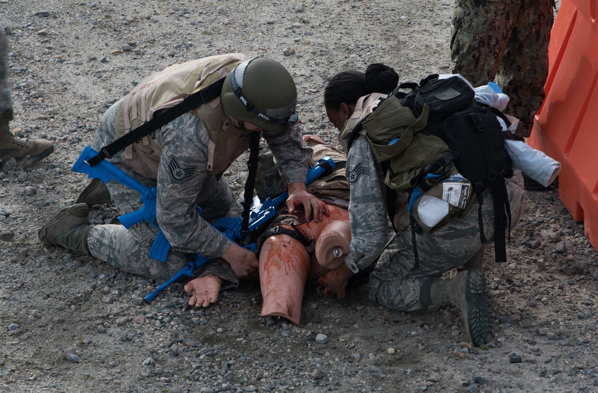 Medics prepare a simulated patient to be moved to a safe environment for treatment at Joint Base Langley-Eustis, Virginia, January 24, 2020. The Tactical Combat Care Course helps medics become physically and mentally prepared to save lives in a hostile environment. (U.S. Air Force photo by Airman 1st Class Sarah Dowe)