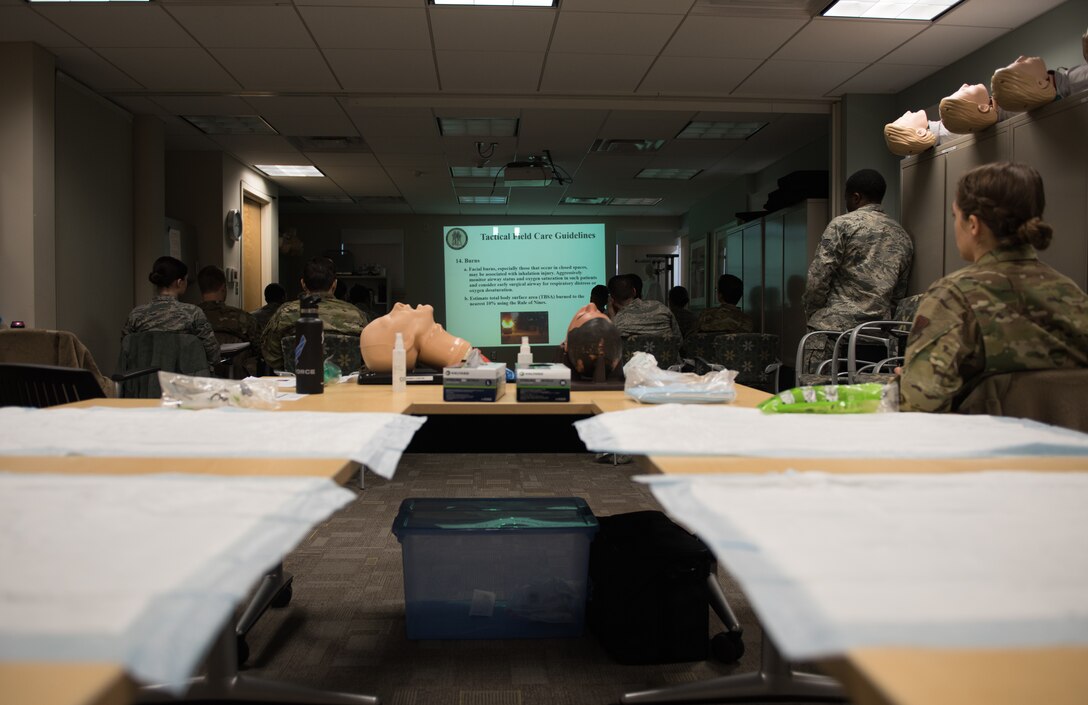 U.S. Air Force medics listen to a brief at Joint Base Langley-Eustis, Virginia, January 22, 2020. The Tactical Combat Care Course teaches medics skills necessary to perform emergency first aid both at home and overseas.  (U.S. Air Force photo by Airman 1st Class Sarah Dowe)