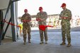 Col. Brandon Klink, left, deputy commander of Task Force Sinai, Maj. Gen. Evan Williams, center, force commander of the Multinational Force and Observers, and Col. Robert Duchaine, commander of Task Force Sinai and the chief of staff for the MFO, cut the ribbon entering the new Supply Support Activity facility on South Camp, Egypt, Jan. 16, 2020. The new facility is essential to the controlled receiving, distribution, issuing and storage of stocked parts supporting the Multinational Force and Observers mission.(U.S. Army photo by Staff Sgt. Eliverto V. Larios)