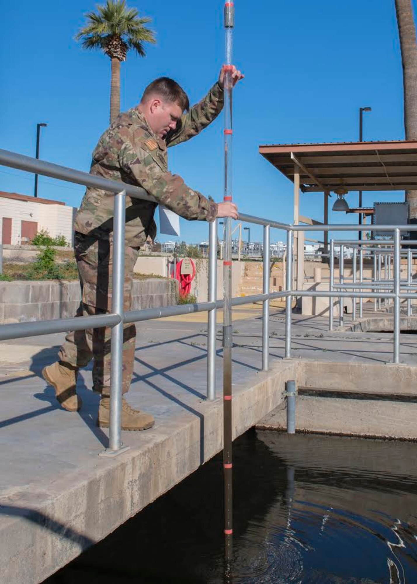 Tech. Sgt. George Vollmer, 56th Civil Engineer Squadron water and fuels systems maintainer, checks if there is proper distribution of water and sewage sludge in the water tanks Jan. 10, 2020, at the Luke Air Force Base Wastewater Plant in Ariz.