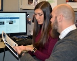 Robert Singley, right, and Taylor Fontana, members of DLA Troop Support Industrial Hardware “Best Practice” Team, discuss scheduling and topics following their inaugural meeting Jan. 30, 2020, in Philadelphia.