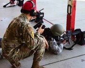 Airman fires a weapon