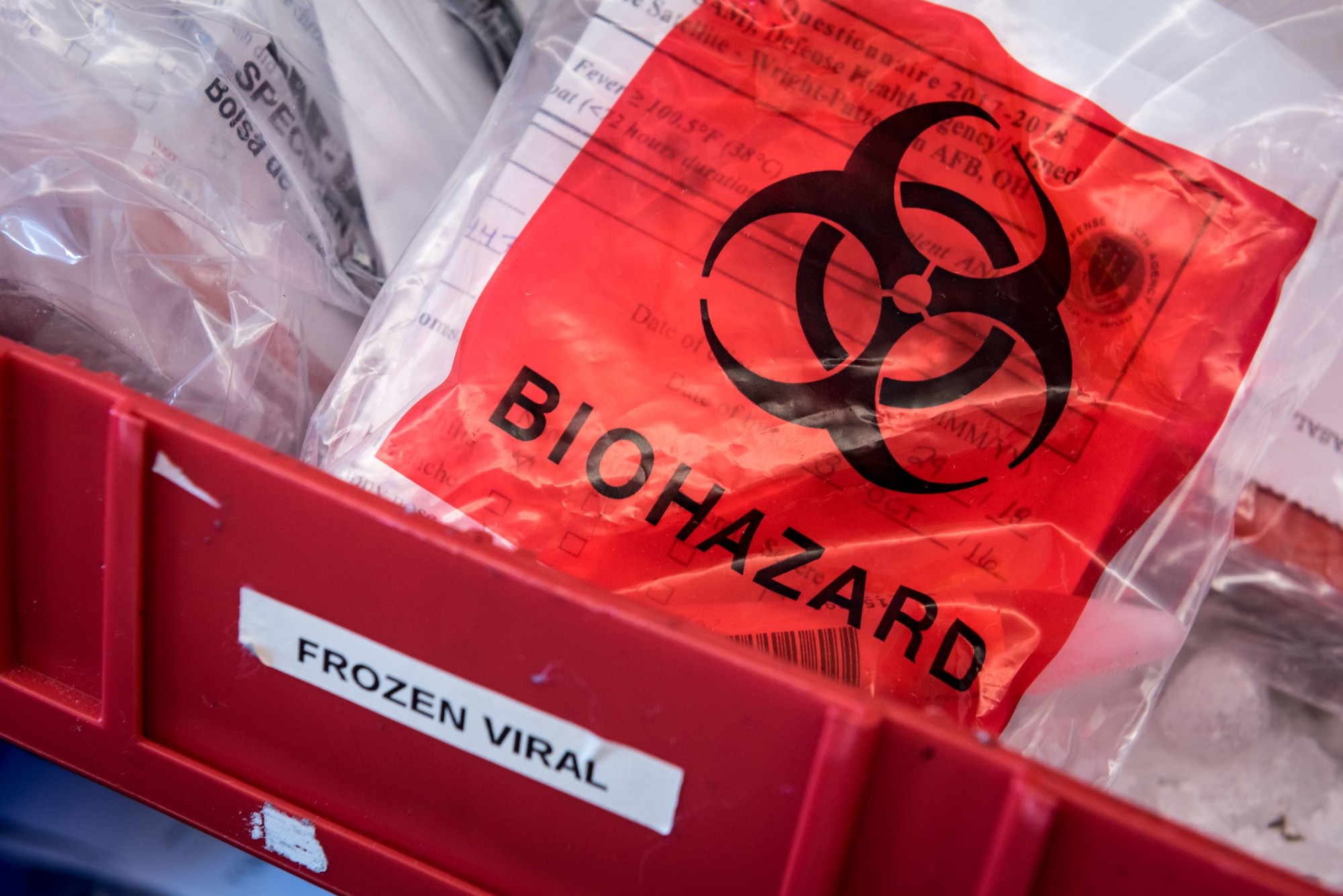 A biohazard logo marks a bag containing one of the 5,000 to 8,000 blood serum, fecal, urine, viral and respiratory samples that arrive six days a week from U.S. Air Force hospitals and clinics worldwide, as well as some other Department of Defense facilities, for analysis at the Epidemiology Laboratory Service, also known as the "Epi Lab" at the 711th Human Performance Wing’s United States Air Force School of Aerospace Medicine and Public Health at Wright Patterson AFB, Ohio.The lab is a Department of Defense reference laboratory offering clinical diagnostic, public health, and force health screening and testing. (U.S. Air Force photo by J.M. Eddins Jr.)