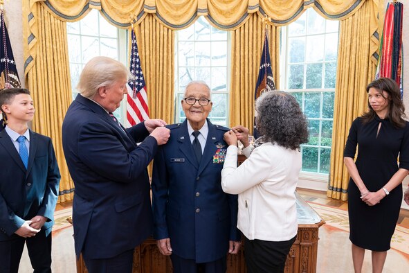 President Donald J. Trump participates in the promotion pinning ceremony for State of the Union Gallery guest and Tuskegee Airman, retired Brig. Gen. Charles McGee, Feb. 4, 2020, in the Oval Office of the White House. (Official White House photo by Shealah Craighead)