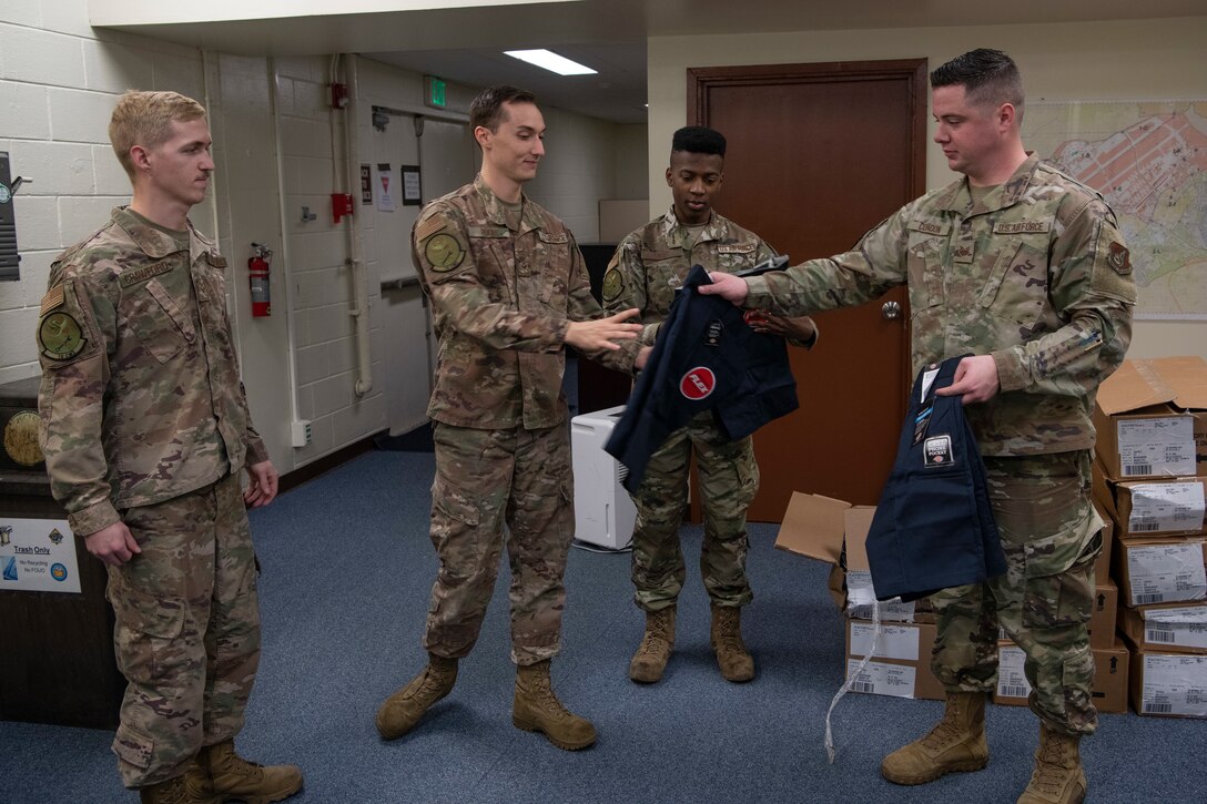 18th Maintenance Group Airmen are issued maintenance shorts for the first time Jan. 14, 2020, at Kadena Air Base, Japan. The shorts are intended to alleviate some of the heat stress maintenance Airmen experience while operating under the hot Okinawa sun. (U.S. Air Force photo by Senior Airman Rhett Isbell)