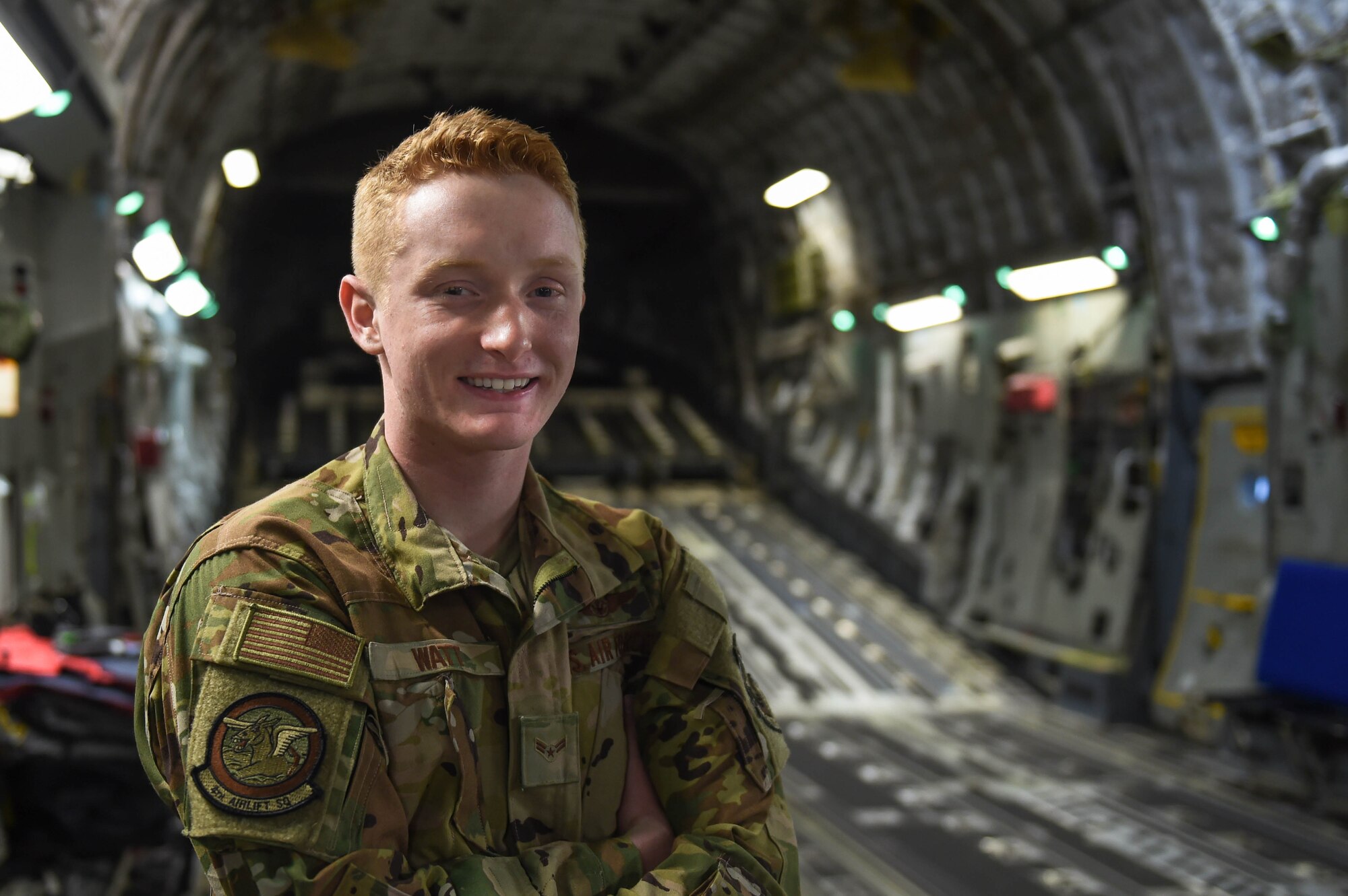 Airman 1st Class Kam Watt, 4th Airlift Squadron loadmaster, poses for a photo inside a C-17 Globemaster III before taking off from Ramstein Air Base, Germany, Dec. 22, 2019. After a seven-day mission, Watt and the rest of the aircrew were headed back to Joint Base Lewis-McChord, Wash. (U.S. Air Force photo by Airman 1st Class Mikayla Heineck)