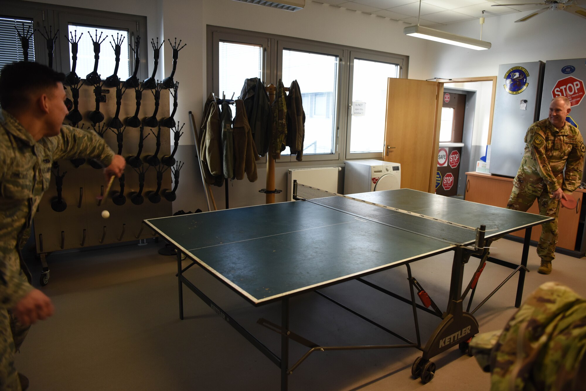 U.S. Air Force Maj. Gen. John Gordy, U.S. Air Force Expeditionary Center commander, plays ping-pong with Airman 1st Class Jaye Gonzalez, 721st Aerial Port Squadron ramp service specialist, during a 521st Air Mobility Operations Wing visit at Ramstein Air Base, Germany, Jan. 29, 2020. Gordy interacted with several Airmen during his Ramstein tour, devoting hours to answering questions and gauging the overall well-being of the 521st AMOW. The USAF Expeditionary Center provides direct oversight for the global en-route system, building partnership capacity mission sets within the global mobility enterprise, as well as installation support for three joint bases