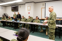 Shipyard Executive Officer Capt. Daniel Rossler speaks at a Surgemain meeting.