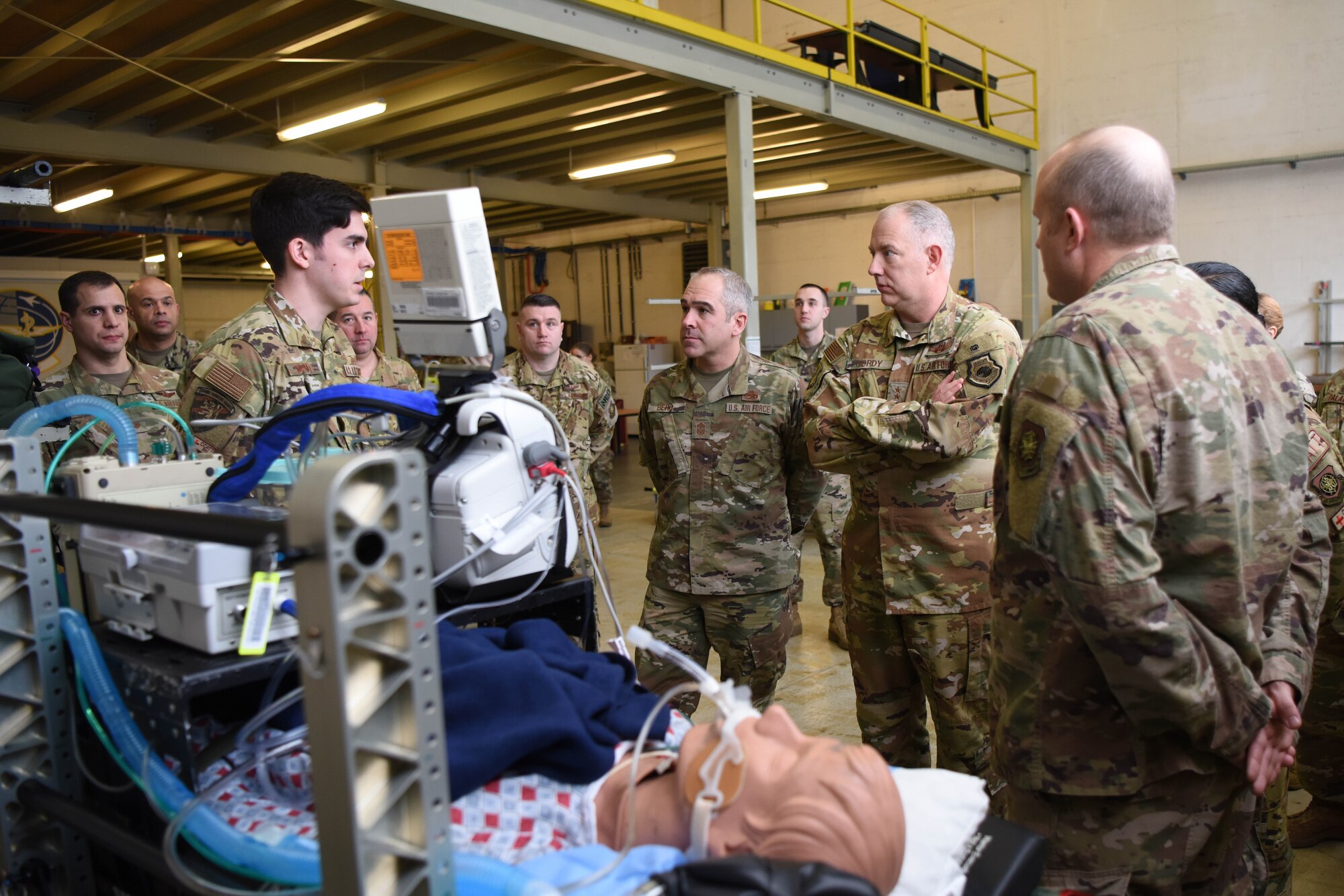 U.S. Air Force Maj. Gen. John Gordy, U.S. Air Force Expeditionary Center commander, and Chief Master Sgt. Kristopher Berg, Air Force Expeditionary Center command chief, watch a demonstration conducted by members of the 86th Aeromedical Evacuation Squadron during a 521st Air Mobility Operations Wing visit at Ramstein Air Base, Germany, Jan. 29, 2020. The 86th AES members simulated critical care measures and explained recent innovation for transit procedures.