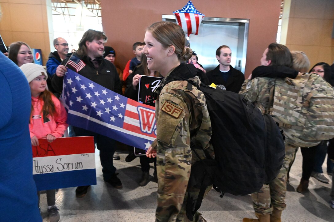 Photo of Senior Airman Courtney Leben returning to Hector International Airport, Fargo, N.D., upon completion of six-month deployment Feb. 5, 2020.