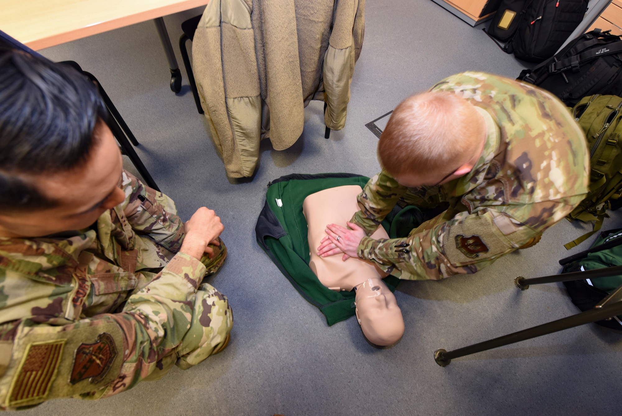 U.S. Air Force 2nd Lt. Israel Cortez, left, 603rd Air and Space Operations Center information operations strategy integrator, and Staff Sgt. Cody Olthoff, 603rd AOC intelligence analyst, practice chest compressions during an adult cardiopulmonary resuscitation and automated external defibrillator class at Ramstein Air Base, Germany, Feb. 4, 2020. Students learned CPR, AED operations and abdominal thrust techniques. Emergencies are possible at any time, and knowledge of life-saving techniques can increase chances of survival for victims of cardiac arrest and choking.