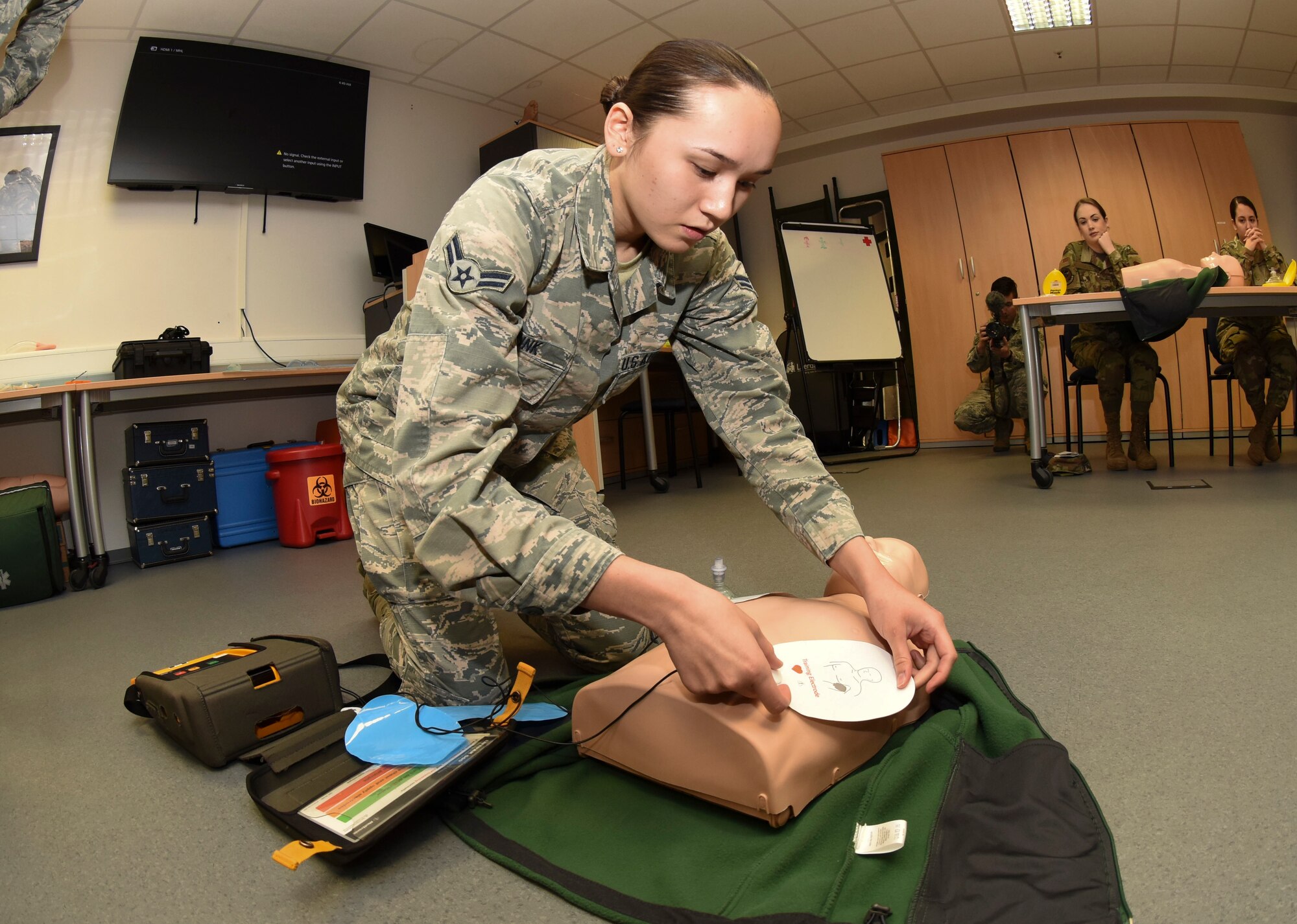 U.S. Air Force Airman 1st Class Bailey Brunk, 21st Operational Weather Squadron forecaster, practices applying automated external defibrillator pads during an adult cardiopulmonary resuscitation and AED class at Ramstein Air Base, Germany, Feb. 4, 2020. In 2019, the 86th Medical Group certified approximately 1500 students through the American Red Cross for CPR. Active-duty service members with duty requirements and personnel seeking to become physical training leaders may sign up for classes. Students take life-saving techniques to their workplaces, allowing Airmen to continue physical training and daily missions in a safer environment.