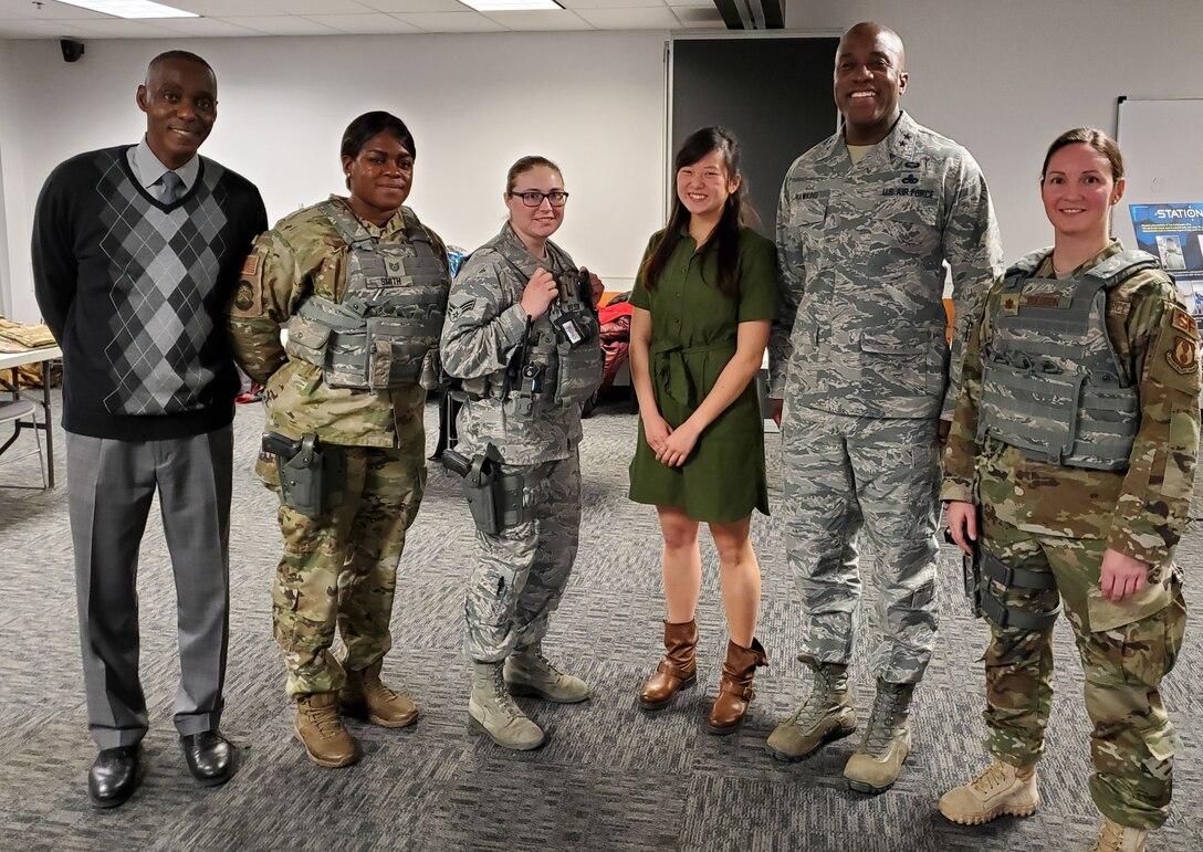 Maj. Gen. Stacey Hawkins (center right), the Director of Logistics, Civil Engineering, Force Protection and Nuclear Integration for Air Force Materiel Command, visited with members of the Air Force Life Cycle Management Center's Human Systems Program Office and the 88th Security Forces Squadron, to discuss the program office’s efforts to acquire body armor for female Airmen that fits properly. (U.S. Air Force photo / Brian Brackens)