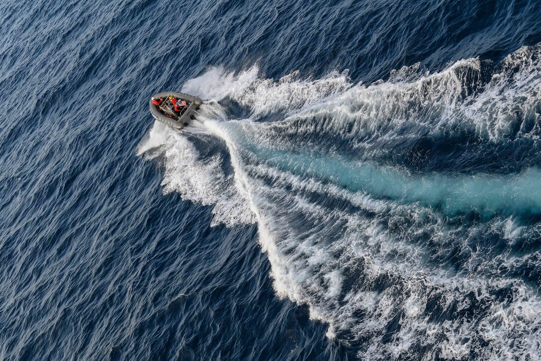 A boat moves through waters.