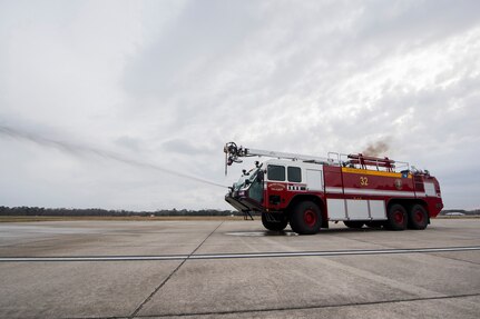 Matthew Callaghan, a firefighter assigned to the 628th Civil Engineer Squadron, sprays water from a firetruck during an operations check at Joint Base Charleston, S.C., Feb. 6, 2020. The base fire department runs daily operations to maintain readiness in case of emergencies such as structure or aircraft fires, injury and other mishaps.