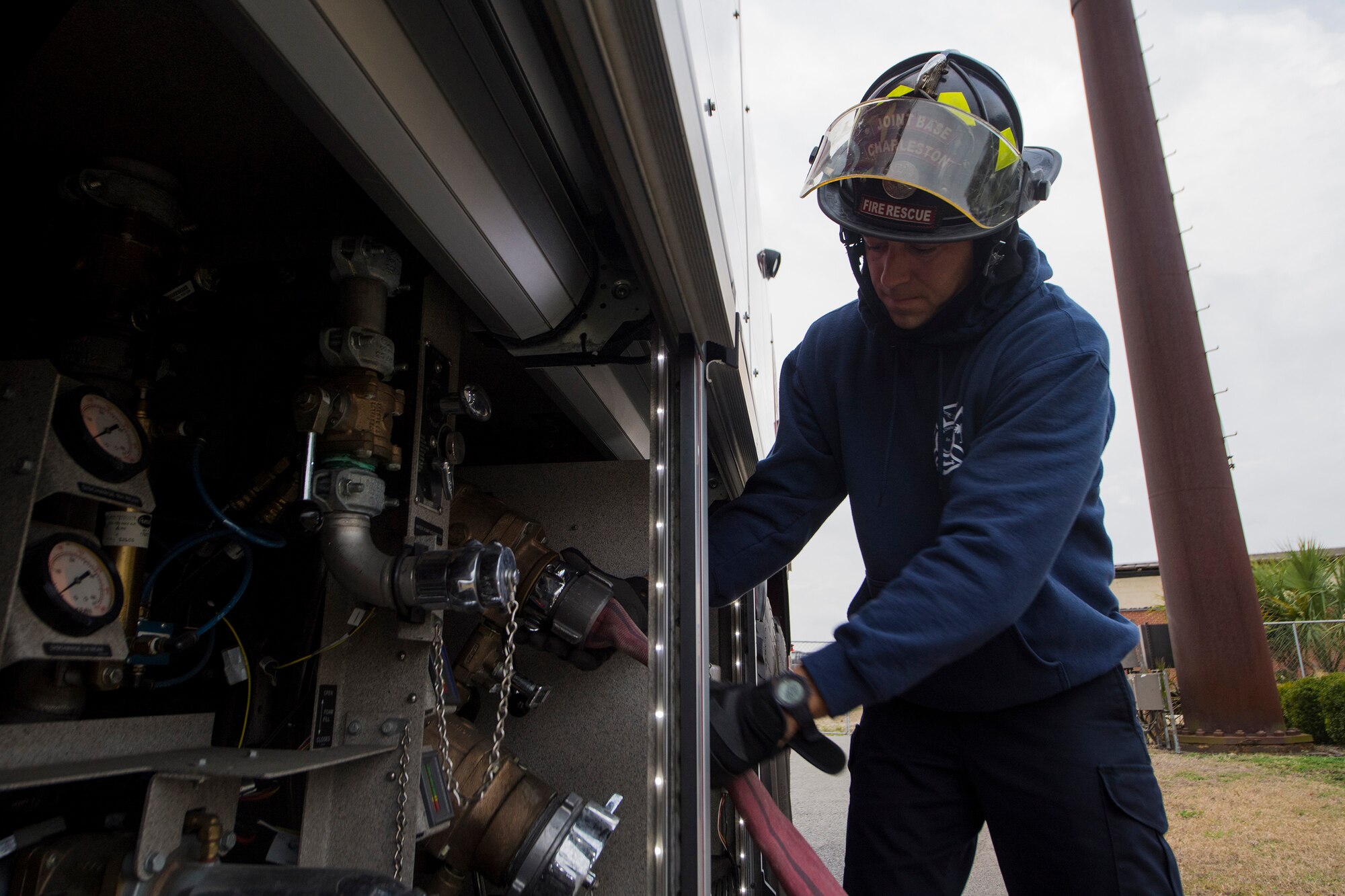 Matthew Callaghan, a firefighter assigned to the 628th Civil Engineer Squadron, attaches a hose to a firetruck to replenish its water supply at Joint Base Charleston, S.C., Feb. 6, 2020. The base fire department runs daily operations to maintain readiness in case of emergencies such as structure or aircraft fires, injury and other mishaps.