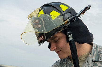 Senior Airman Nicholas Cadwell, a driver operator 628th Civil Engineer Squadron fire department, looks down from a firetruck bucket at Joint Base Charleston, S.C., Feb. 6, 2020. The base fire department runs daily operations to maintain readiness in case of emergencies such as structure or aircraft fires, injury and other mishaps.