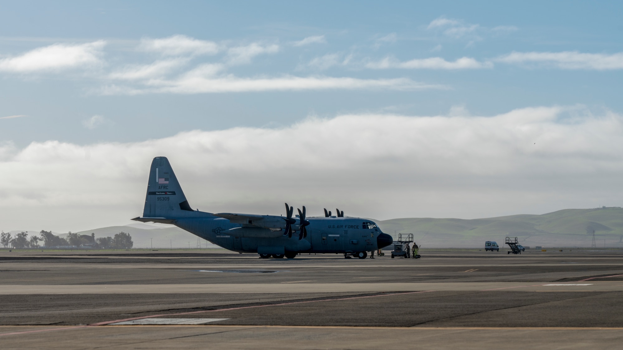A WC-130J Super Hercules aircraft from the 53rd Weather Reconnaissance Squadron sits on the flightline prior to an atmospheric river mission Jan. 27 at Travis Air Force Base, Calif. The Hurricane Hunters are slated to perform “AR recon” from January through March. Scientists led by Scripps Institution of Oceanography at University of California, San Diego, in partnership with the 53rd WRS, National Oceanic and Atmospheric Aviation’s National Weather Service and Office of Marine and Aviation Operations, will be on standby to fly through these ARs over the Pacific to gather data to improve forecasts. (U.S. Air Force photo by Tech. Sgt. Christopher Carranza)