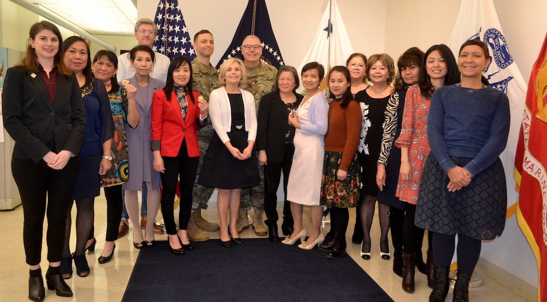 Army Col. Bob Wichman, the DLA Chaplain, center, poses with the DLA Troop Support Flag Room team during a visit Feb. 5, 2020 at DLA Troop Support in Philadelphia.