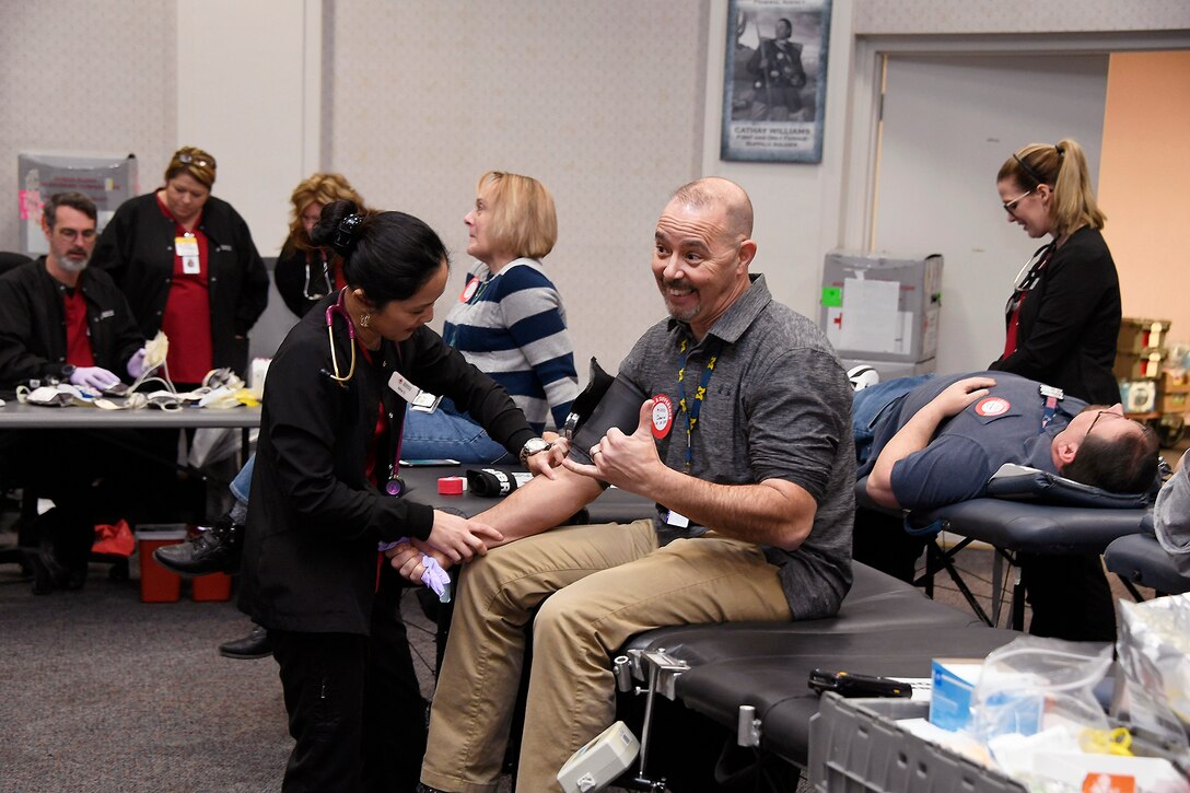 An employee finishes his donation at the Hart-Dole-Inouye Federal Center donate during the Feb. 5 blood drive.