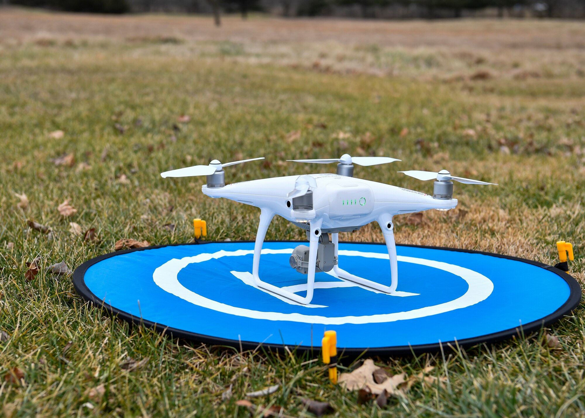 Photo of a drone sitting on a landing pad.