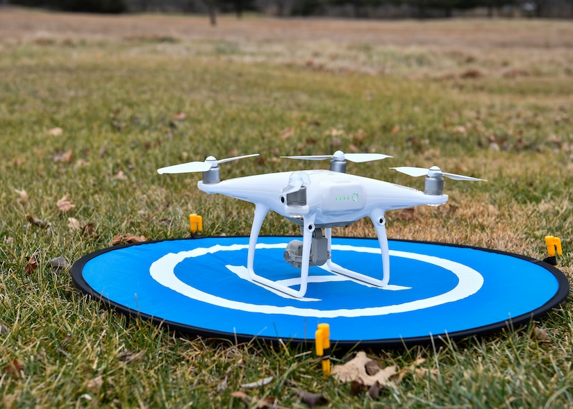 Photo of a drone sitting on a landing pad.