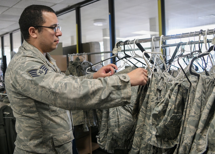Staff Sgt. Frankie Mattox, a finance manager assigned to the 628th Comptroller Squadron, browses the uniform rack at the Airman’s Attic at Joint Base Charleston, S.C., Feb. 5, 2020. The Airman’s Attic, located in building 1950 on the Air Base, offers no-cost items including clothing, toys and household goods for military members E-5 and below and their immediate families. The recapitalization of the donated goods can help take care of service members and their families by alleviating various financial stressors they may encounter. (U.S. Air Force photo by Senior Airman Joshua R. Maund)