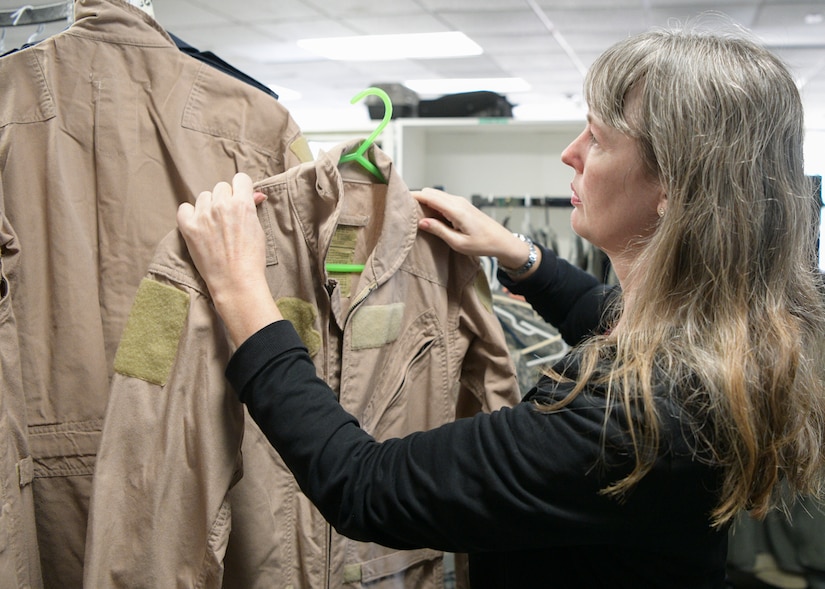 Staff Sgt. Frankie Mattox, a finance manager assigned to the 628th Comptroller Squadron, browses the uniform rack at the Airman’s Attic at Joint Base Charleston, S.C., Feb. 5, 2020. The Airman’s Attic, located in building 1950 on the Air Base, offers no-cost items including clothing, toys and household goods for military members E-5 and below and their immediate families. The recapitalization of the donated goods can help take care of service members and their families by alleviating various financial stressors they may encounter. (U.S. Air Force photo by Senior Airman Joshua R. Maund)