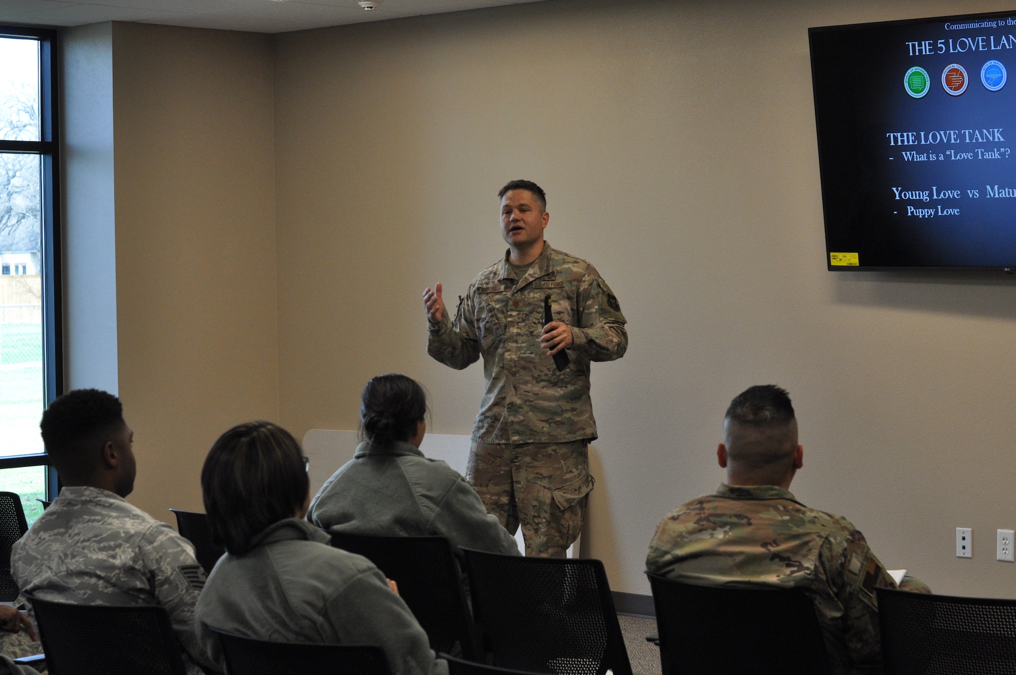 301st Fighter Wing Deputy Wing Chaplain Maj. Jonathan Farquhar addresses attendees of The Five Love Languages class held at Naval Air Station Joint Reserve Base Fort Worth, Texas on Jan. 11, 2020. The purpose of the class was to challenge Airmen to reform their thinking when it comes to communication in order to improve professional relationships and enhance effective workplace environments. (U.S. Air Force Photo by Staff Sgt. Randall Moose)