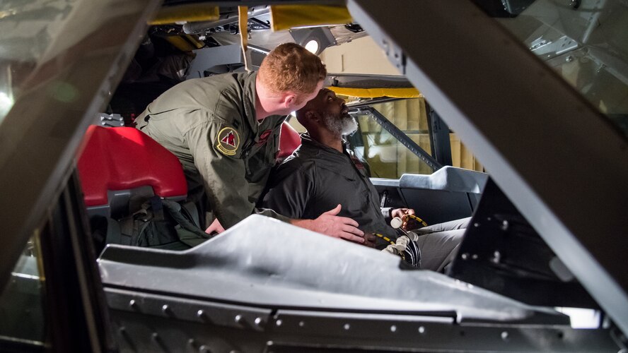 Karl Malone (right), NBA Hall of Famer, sits in a B-52H Stratofortress simulator while receiving egress training from Capt. Cameron Gill (left), 96th Bomb Squadron weapon systems officer, at Barksdale Air Force Base, La., Feb. 4, 2020. Malone received training from the 96th Bomb Squadron and the 2nd Operations Support Squadron in the case of an emergency. (U.S. Air Force photo by Airman 1st Class Jacob B. Wrightsman)