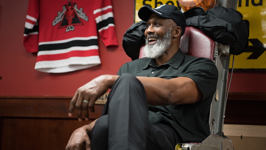 Karl Malone, NBA Hall of Famer, sits in a decommissioned aircraft seat in the 96th Bomb Squadron during a visit at Barksdale Air Force Base, La., Feb. 4, 2020. Malone spent time visiting with Airmen, touring various squadrons and even taking a ride in a B-52H Stratofortress. (U.S. Air Force photo by Airman 1st Class Jacob B. Wrightsman)