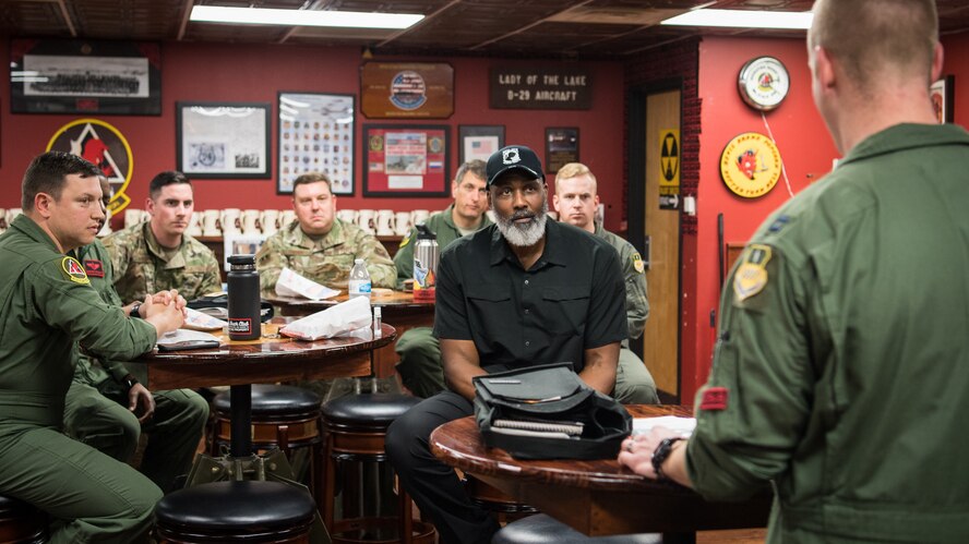 Karl Malone, NBA Hall of Famer, recieves a pre-flight brief prior to his flight with the 96th Bomb Squadron at Barksdale Air Force Base, La., Feb. 4, 2020. Malone spent time with Airmen, toured facilities and even took a ride in a B-52H Stratofortress. (U.S. Air Force photo by Airman 1st Class Jacob B. Wrightsman)