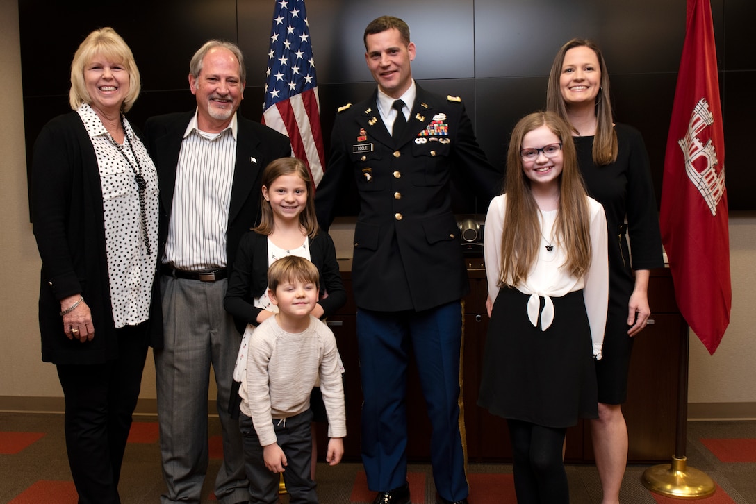Justin Toole, U.S. Army Corps of Engineers Nashville District deputy commander and newest lieutenant colonel in the Army, poses with his family during his promotion ceremony at the Nashville District Headquarters in Nashville, Tennessee, Feb. 6, 2020. From Left to right are his parents Arlene and Rick, daughter Mya, son Ben, Toole, daughter Caroline, and wife Katy. (USACE photo by Lee Roberts)
