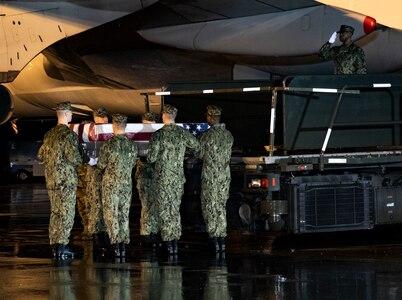 A U.S. Navy carry team transfers the remains of Petty Officer 3rd Class Eduardo M. RoqueVazquez, of Kissimmee, Fla., Feb. 6, 2020 at Dover Air Force Base, Del. RoqueVazquez was assigned USS Farragut. (U.S. Air Force Photo by Senior Airman Eric M. Fisher)