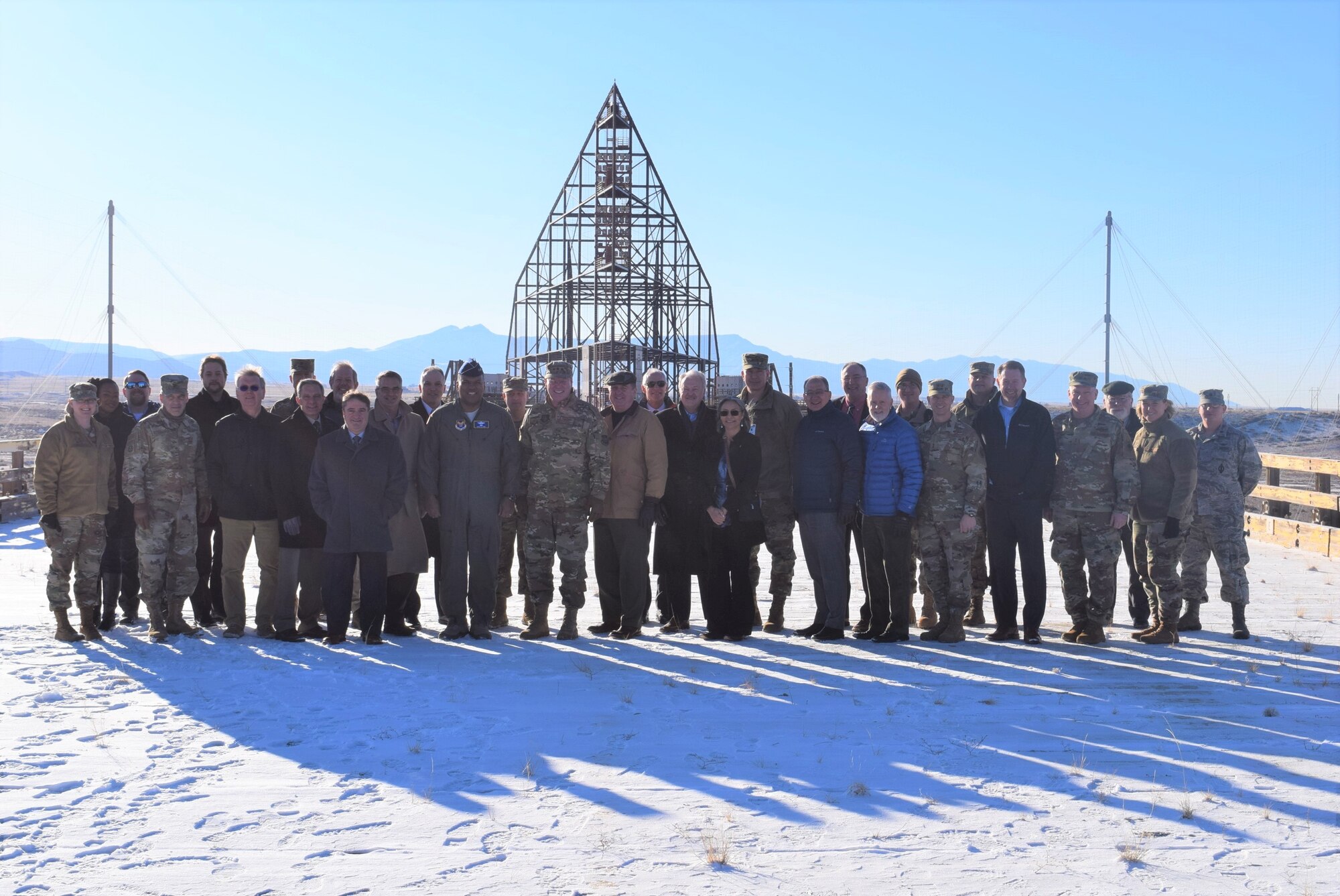 The Air Force Nuclear Issues Resolution and Integration Board held its winter meeting at the center on Feb. 6, 2020, at Kirtland AFB, New Mexico. While there, board members stopped for a photo in front of the Kirtland AFB Trestle Facility. A landmark of the Cold War, it was built in the 1970s to test the effects of an electromagnetic pulse on aircraft and is considered one of the largest all-wood structures in the world, right down to its bolts. (Air Force photo by Capt. Mike Ford).
