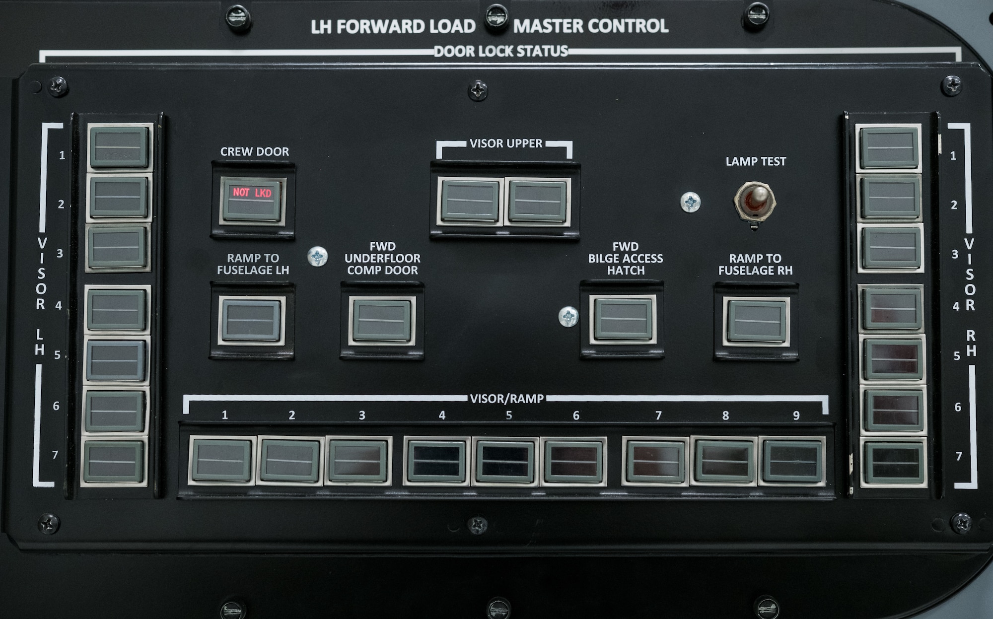 A simulated crew door “NOT LOCKED” light is illuminated on the C-5M left-hand forward loadmaster control panel trainer Jan. 28, 2020, at the 373rd Training Squadron, Detachment 3 on Dover Air Force Base, Del. During a recent mission dubbed Reach 190, an aircrew from the 9th Airlift Squadron had this light illuminate, causing a “PRESS DOOR OPEN” warning to simultaneously appear on the pilot’s, copilot’s and flight engineer’s Multifunction Display Units. (U.S. Air Force photo by Roland Balik)