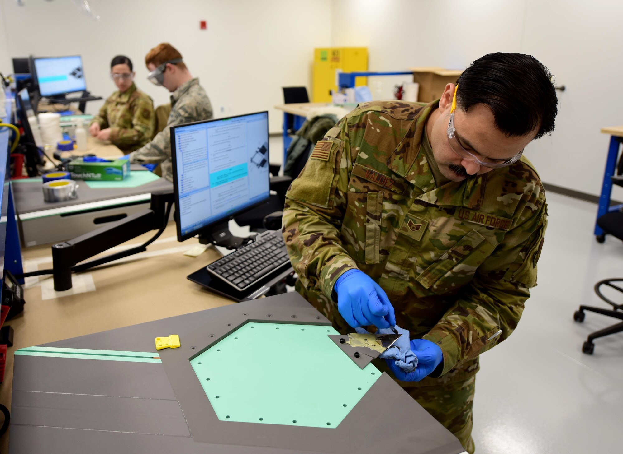 U.S. Air Force Staff Sgt. Gregory Valdez, a 354th Maintenance Squadron F-35A Lightning II Low Observable Aircraft Structural Maintenance Craftsman, conducts a paste repair on an F-35 test panel Jan. 23, 2020, at the field training detachment (FTD) on Eielson Air Force Base, Alaska.