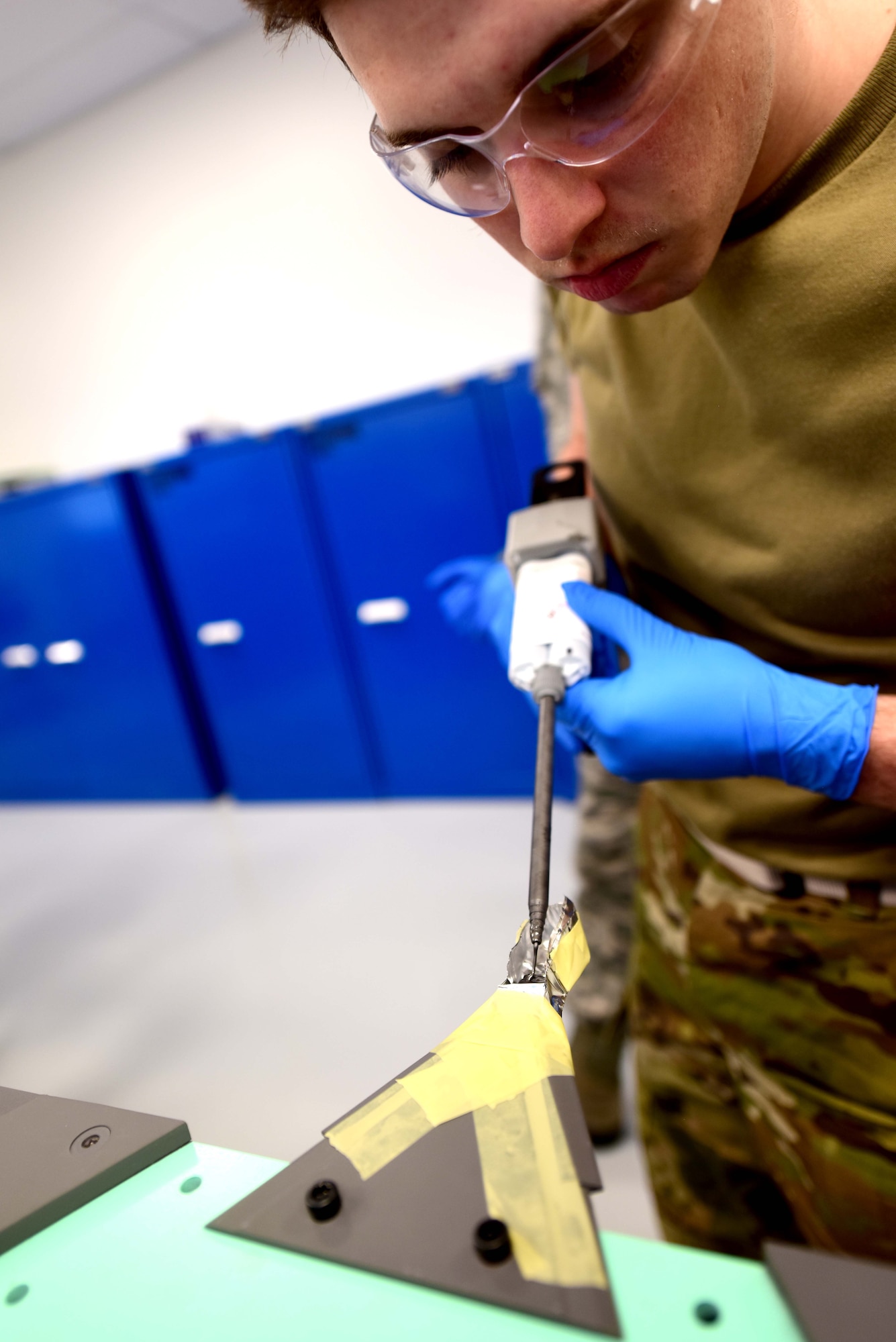U.S. Air Force Airman Bradley Brajkovich, a 354th Maintenance Squadron F-35A Lightning II Low Observable Aircraft Structural Maintenance journeyman, conducts a paste repair on an F-35 test panel Jan. 23, 2020, at the field training detachment on Eielson Air Force Base, Alaska.