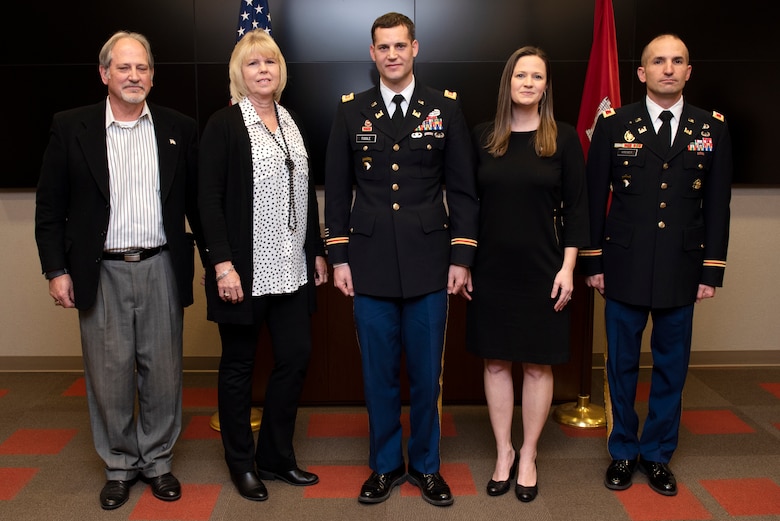(Left to Right) Rick Toole; Arlene Toole; Maj. Justin Toole, U.S. Army Corps of Engineers Nashville District deputy commander; Katy Toole; and Col. Paul Kremer, Great Lakes and Ohio River Division deputy commander; pose right before promoting the major to the rank of lieutenant colonel during a ceremony at the Nashville District Headquarters in Nashville, Tennessee, Feb. 6, 2020. Rick and Arlene are Justin’s parents. Katy is his wife. (USACE Photo by Lee Roberts)