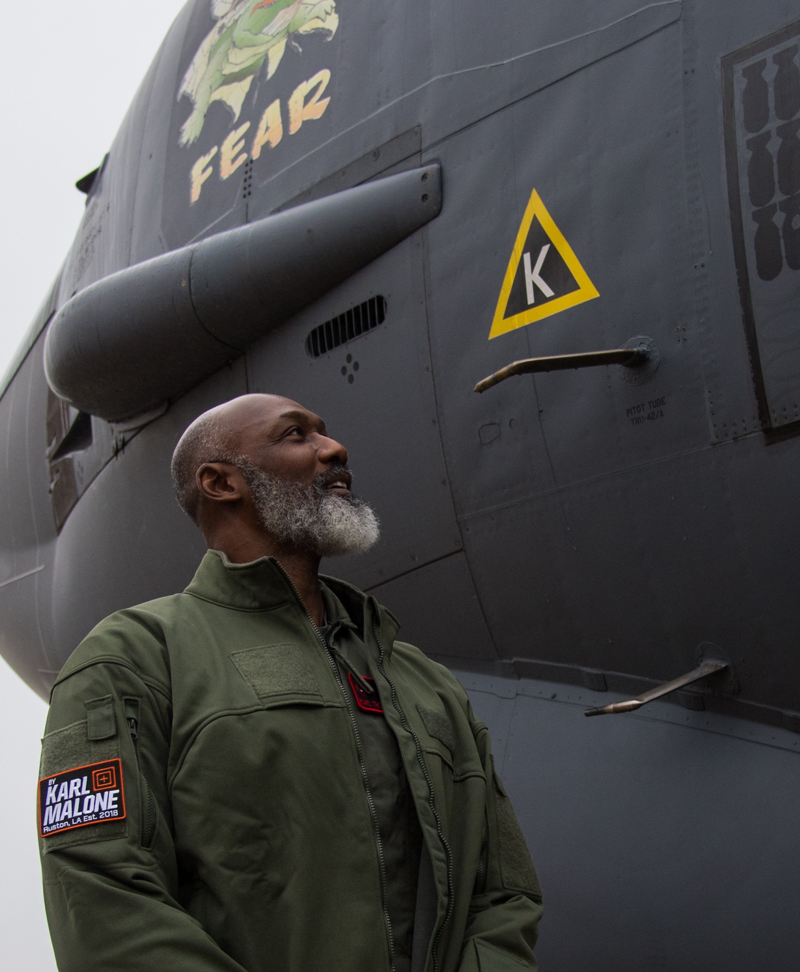 Karl Malone, NBA Hall of Famer, stands next to a B-52H Stratofortress during a visit at Barksdale Air Force Base, La., Feb. 5, 2020. Malone flew a training sortie with the 96th Bomb Squadron during his visit. (U.S. Air Force photo by Airman 1st Class Jacob B. Wrightsman)