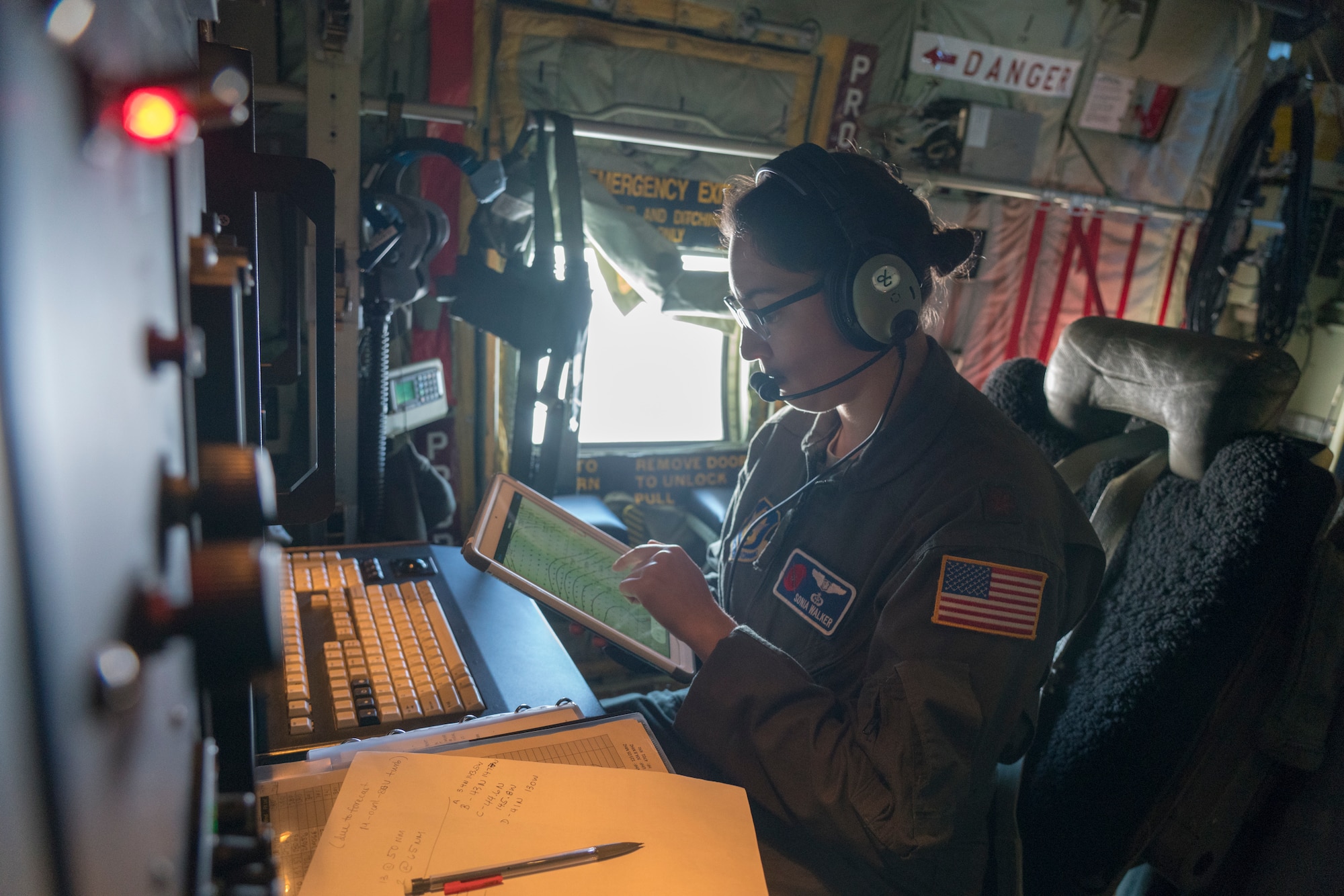 Maj. Sonia Walker, 53rd Weather Reconnaissance Squadron aerial weather reconnaissance officer, checks her tablet for information during an atmospheric river mission Jan. 28, over the Pacific Ocean. The Hurricane Hunters are slated to perform “AR recon” from January through March. Scientists led by Scripps Institution of Oceanography at University of California, San Diego, in partnership with the 53rd WRS, National Oceanic and Atmospheric Aviation’s National Weather Service and Office of Marine and Aviation Operations, will be on standby to fly through these ARs over the Pacific to gather data to improve forecasts. (U.S. Air Force photo by Tech. Sgt. Christopher Carranza)