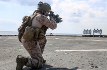 A Marine assigned to Echo Company, Battalion Landing Team, 2nd Battalion, 8th Marine Regiment, 26th Marine Expeditionary Unit, shoots a table 5 modification course aboard the amphibious transport dock USS New York (LPD 21) while at sea, Jan. 30, 2020. Bataan Amphibious Ready Group, with embarked 26th MEU, is deployed to the U.S. 5th Fleet area of operations in support of maritime security operations to reassure allies and partners and preserve the freedom of navigation and the free flow of commerce in the region. (U.S. Marine Corps photo by Staff Sgt. Patricia A. Morris)