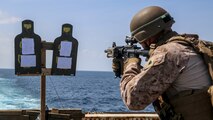 A Marine assigned to Echo Company, Battalion Landing Team, 2nd Battalion, 8th Marine Regiment, 26th Marine Expeditionary Unit, shoots a table 5 modification course aboard the amphibious transport dock USS New York (LPD 21) while at sea, Jan. 30, 2020. Bataan Amphibious Ready Group, with embarked 26th MEU, is deployed to the U.S. 5th Fleet area of operations in support of maritime security operations to reassure allies and partners and preserve the freedom of navigation and the free flow of commerce in the region. (U.S. Marine Corps photo by Staff Sgt. Patricia A. Morris)